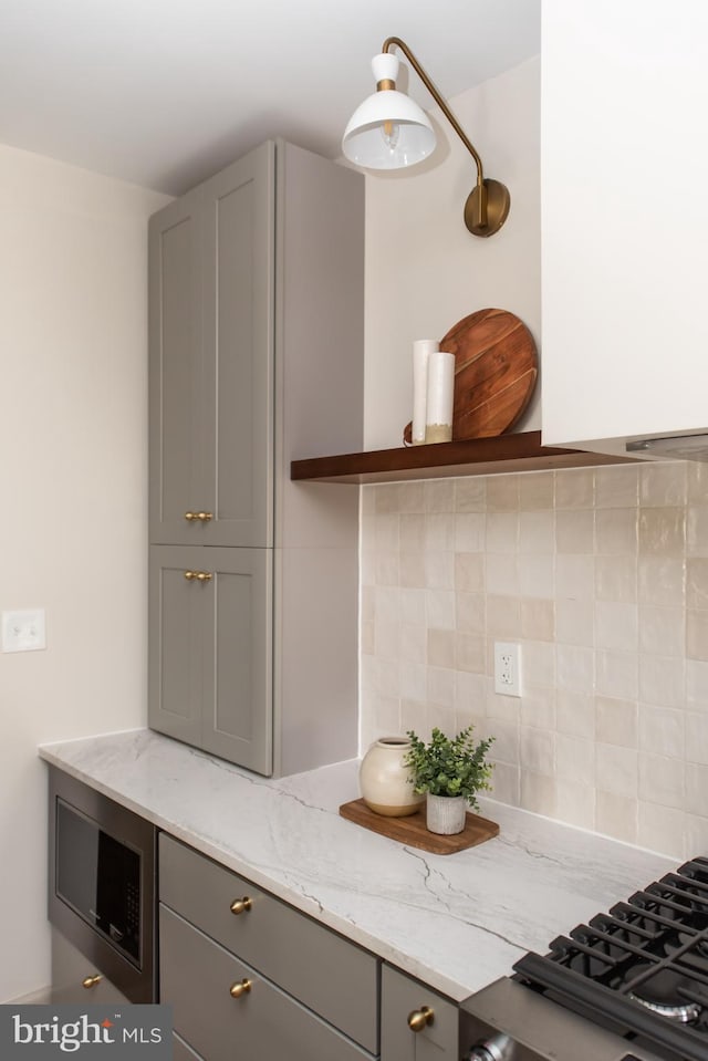 110 Varnum St NW, Washington, DC 20011 - kitchen featuring gray cabinetry, light stone countertops, backsplash, and open shelves