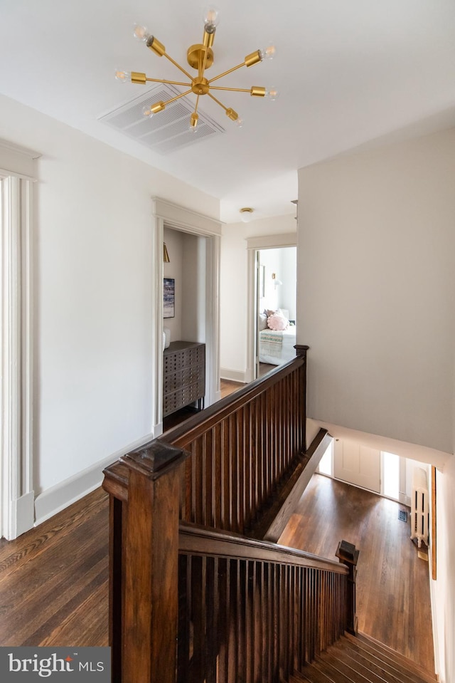 110 Varnum St NW, Washington, DC 20011 - stairway featuring a chandelier and wood finished floors