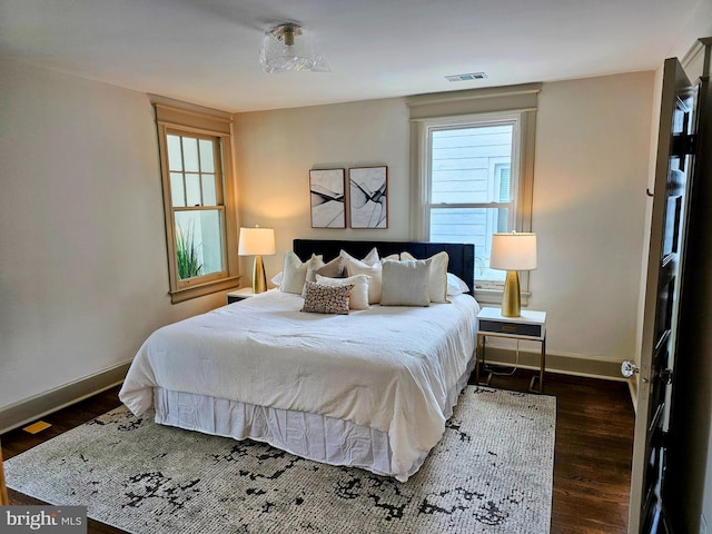 110 Varnum St NW, Washington, DC 20011 - bedroom with dark wood-style flooring and baseboards