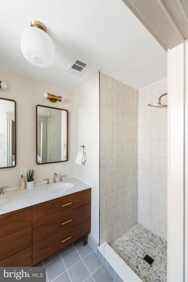 110 Varnum St NW, Washington, DC 20011 - bathroom with double vanity, tile patterned flooring, and a tile shower
