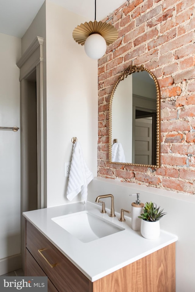 110 Varnum St NW, Washington, DC 20011 - bathroom with vanity and brick wall