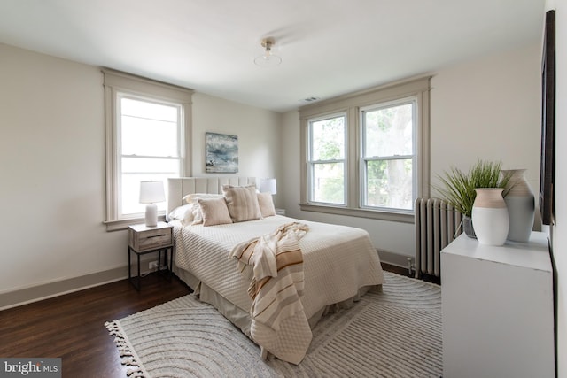 110 Varnum St NW, Washington, DC 20011 - bedroom featuring radiator heating unit, wood finished floors, and baseboards