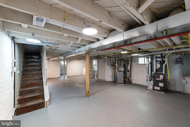 110 Varnum St NW, Washington, DC 20011 - below grade area featuring gas water heater, heating unit, and stairway