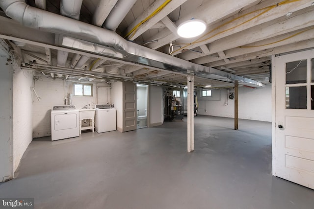 110 Varnum St NW, Washington, DC 20011 - below grade area featuring washer and clothes dryer and a sink