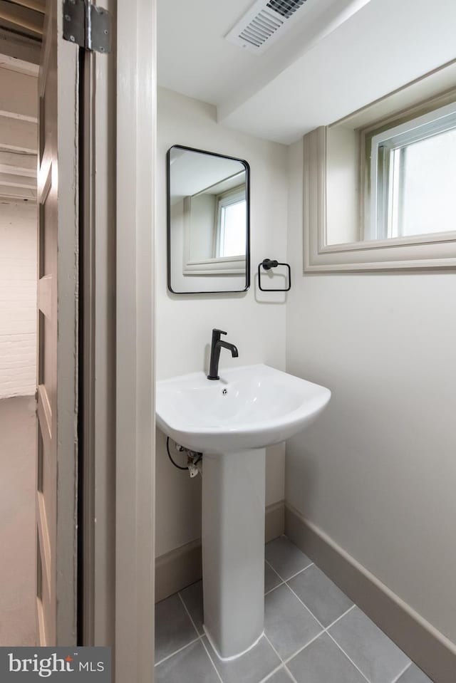 110 Varnum St NW, Washington, DC 20011 - bathroom with baseboards and tile patterned floors