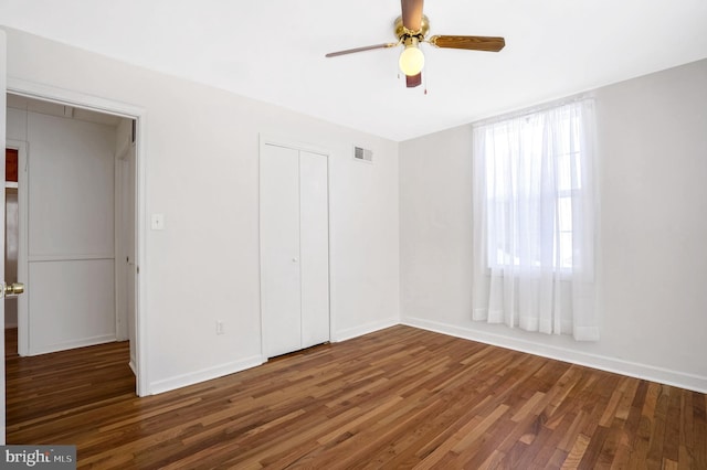6710 Red Jacket Rd, Springfield, VA 22152 - unfurnished bedroom featuring wood finished floors, a closet, and baseboards