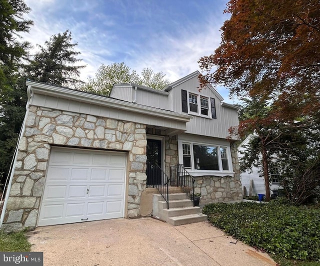 211 N Vineyard Blvd, Collingswood, NJ 08108 - view of front of home with stone siding, a garage, and driveway