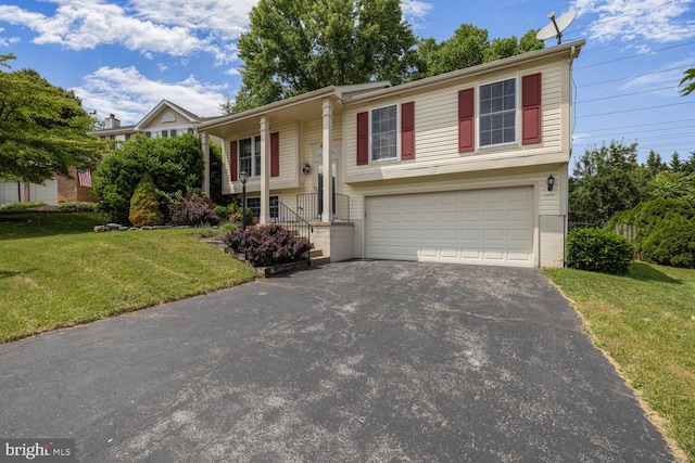 6402 Devonshire Ln, Frederick, MD 21703 - bi-level home featuring driveway, a garage, and a front yard