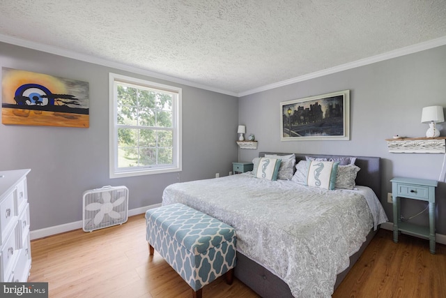 6402 Devonshire Ln, Frederick, MD 21703 - bedroom featuring wood finished floors, a textured ceiling, baseboards, and ornamental molding