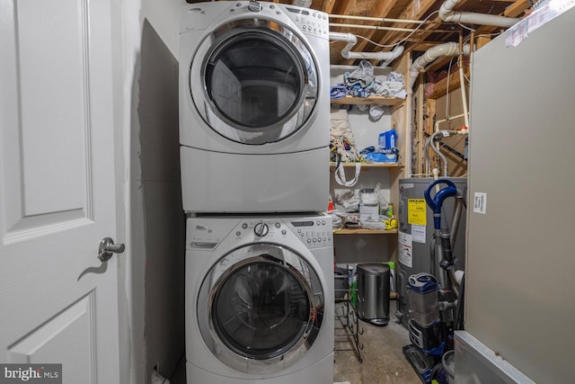 6402 Devonshire Ln, Frederick, MD 21703 - laundry room with stacked washer / dryer and electric water heater