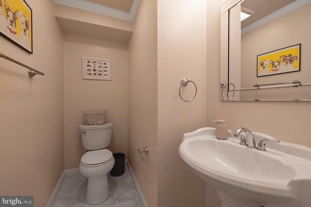 6402 Devonshire Ln, Frederick, MD 21703 - half bath featuring marble look tiles, crown molding, baseboards, toilet, and a sink