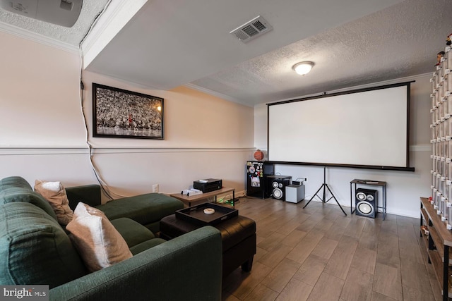 6402 Devonshire Ln, Frederick, MD 21703 - cinema featuring a textured ceiling, wood finished floors, and crown molding