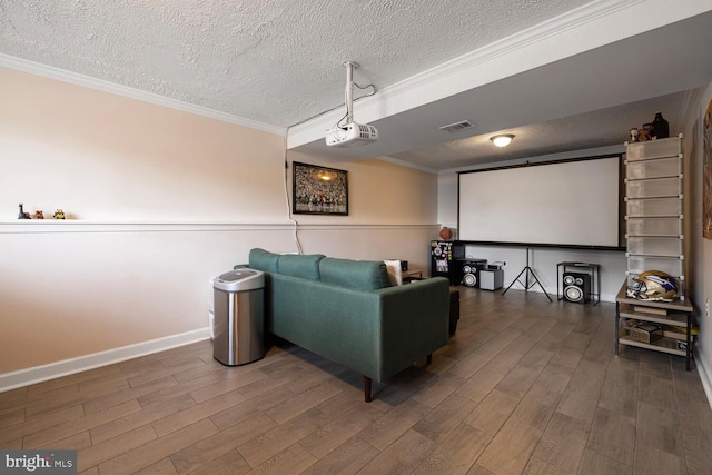 6402 Devonshire Ln, Frederick, MD 21703 - cinema room with a textured ceiling, ornamental molding, wood finished floors, and baseboards