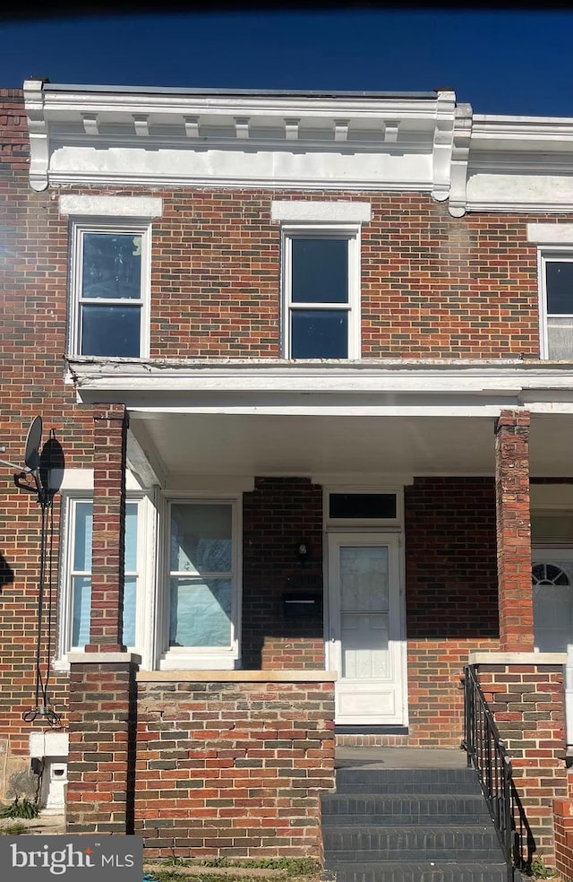 3414 Cardenas Ave, Baltimore, MD 21213 - view of front facade with brick siding and a porch