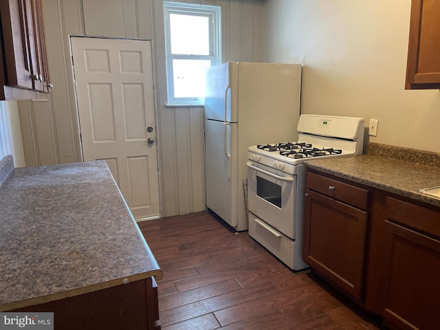 3414 Cardenas Ave, Baltimore, MD 21213 - kitchen with white appliances, dark wood-type flooring, and dark countertops