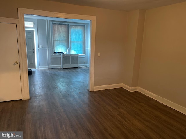 3414 Cardenas Ave, Baltimore, MD 21213 - spare room featuring dark wood-type flooring and baseboards