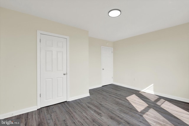 443 N 2nd St, Wormleysburg, PA 17043 - unfurnished bedroom featuring dark wood finished floors and baseboards