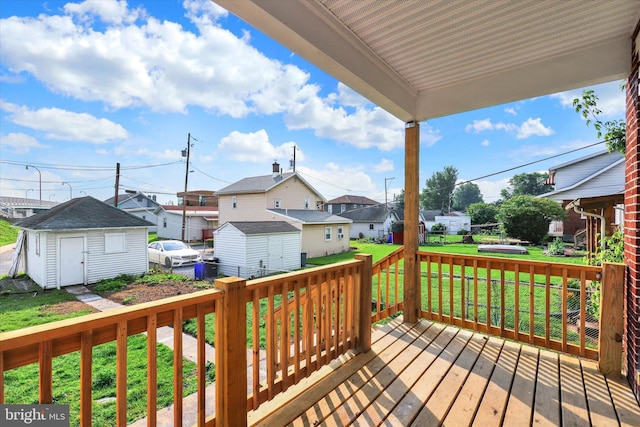 443 N 2nd St, Wormleysburg, PA 17043 - wooden deck featuring a residential view, a storage unit, and a yard