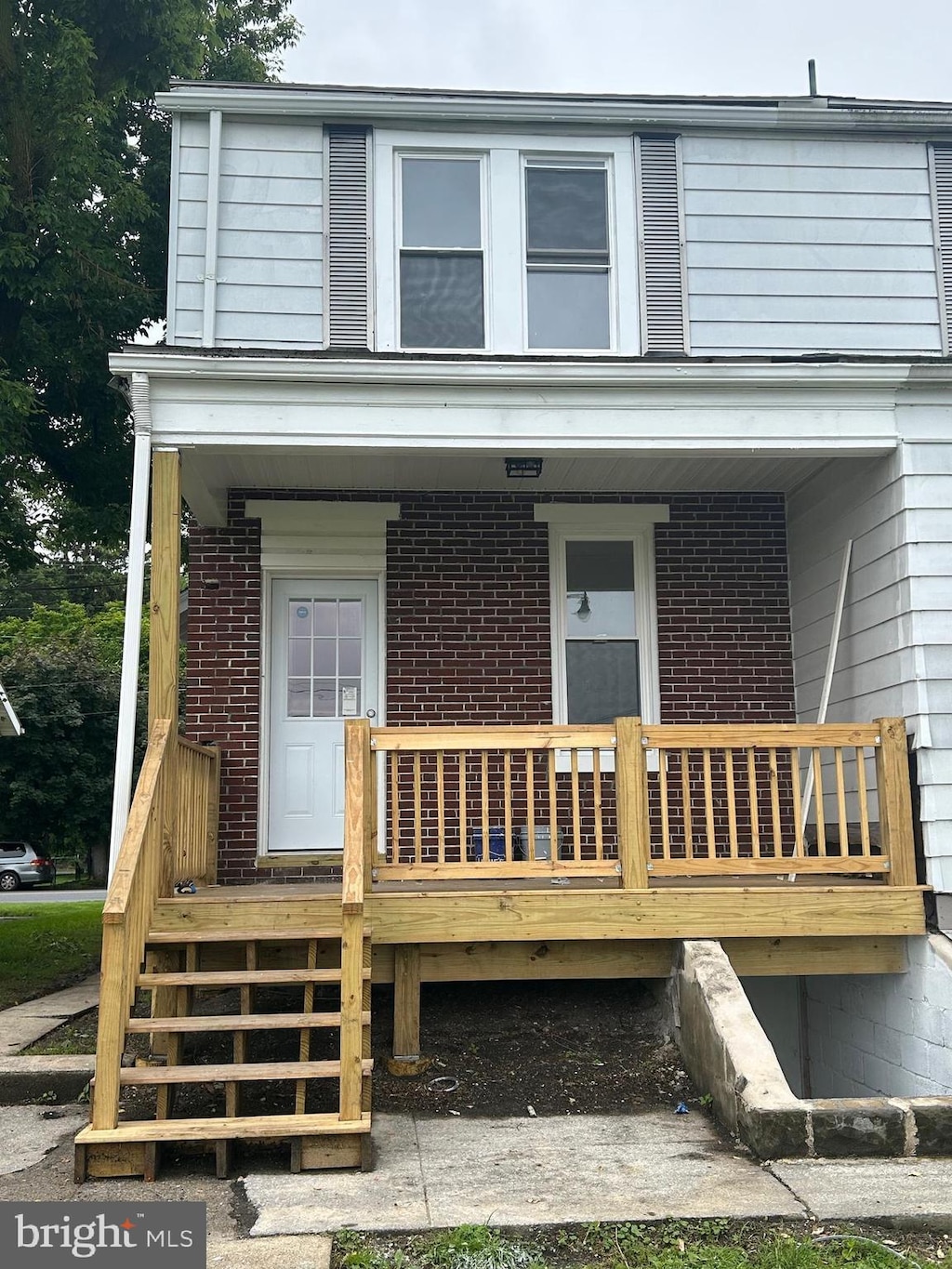 443 N 2nd St, Wormleysburg, PA 17043 - view of front of home with brick siding and a porch
