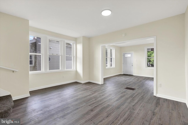 443 N 2nd St, Wormleysburg, PA 17043 - unfurnished living room featuring dark wood-type flooring and baseboards