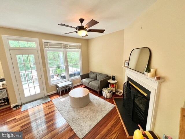 1310 Sundial Dr, Reston, VA 20194 - living area with wood finished floors, healthy amount of natural light, and a fireplace