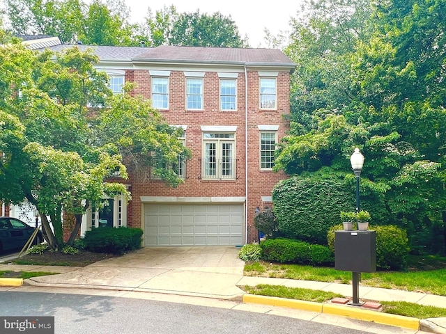 1310 Sundial Dr, Reston, VA 20194 - view of front of home featuring a garage, driveway, and brick siding