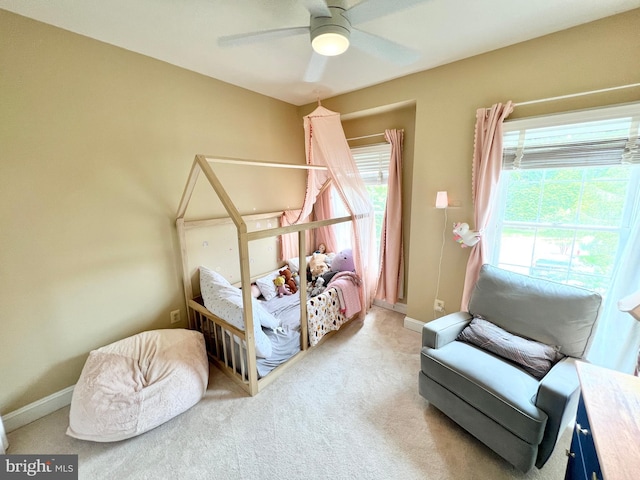 1310 Sundial Dr, Reston, VA 20194 - carpeted bedroom with multiple windows and ceiling fan