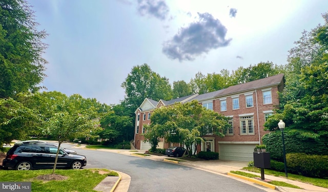 1310 Sundial Dr, Reston, VA 20194 - view of asphalt street featuring curbs, street lighting, and sidewalks