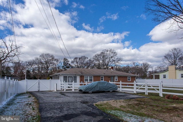 2784 Moran Dr, Waldorf, MD 20601 - view of front of property featuring a gate, a chimney, and brick siding