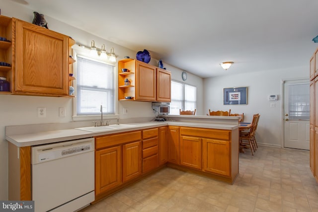 2784 Moran Dr, Waldorf, MD 20601 - kitchen with white dishwasher, open shelves, a sink, a peninsula, and light countertops