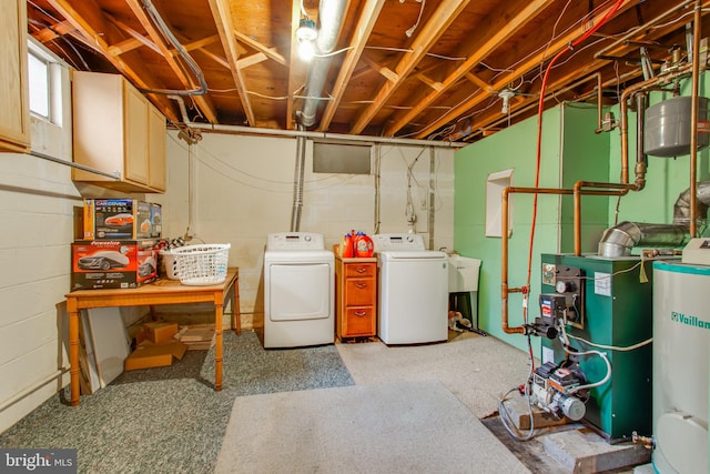 2784 Moran Dr, Waldorf, MD 20601 - basement featuring washing machine and dryer, a heating unit, concrete block wall, and a sink