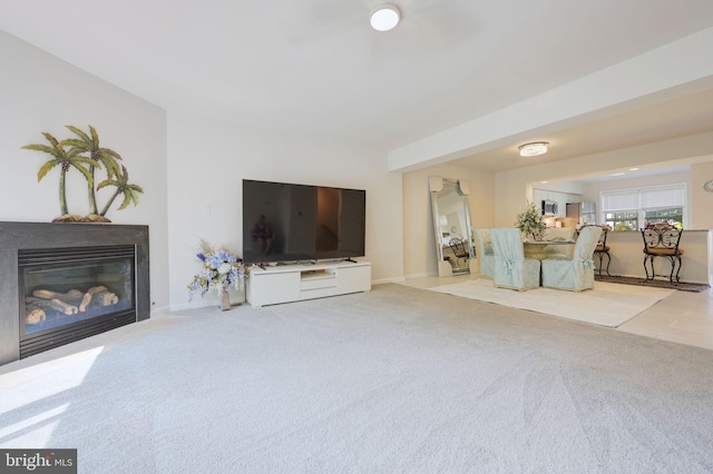 17455 Kagera Dr, Dumfries, VA 22025 - carpeted living area with a fireplace with flush hearth and baseboards
