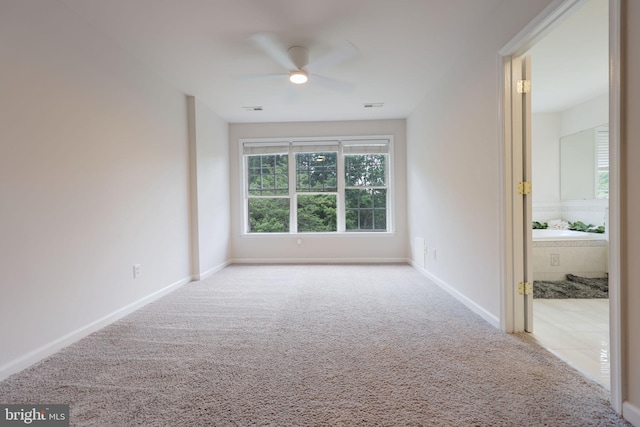 17455 Kagera Dr, Dumfries, VA 22025 - spare room featuring carpet flooring, a ceiling fan, and baseboards
