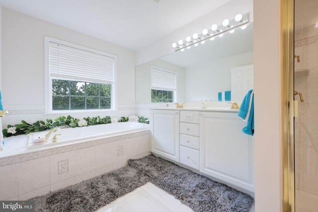 17455 Kagera Dr, Dumfries, VA 22025 - bathroom with tile patterned flooring, a bath, a shower stall, and double vanity
