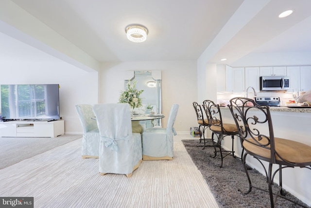 17455 Kagera Dr, Dumfries, VA 22025 - dining space featuring baseboards, recessed lighting, and light colored carpet