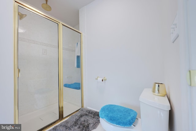 17455 Kagera Dr, Dumfries, VA 22025 - bathroom with toilet, a shower stall, and baseboards