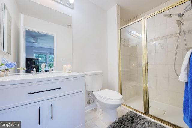 17455 Kagera Dr, Dumfries, VA 22025 - bathroom featuring toilet, vanity, a stall shower, and tile patterned flooring