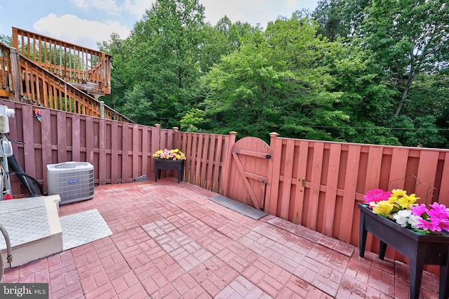 17455 Kagera Dr, Dumfries, VA 22025 - view of patio / terrace featuring a gate and central AC