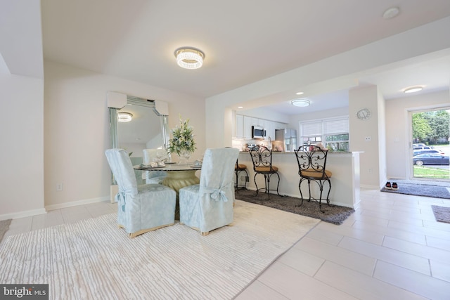 17455 Kagera Dr, Dumfries, VA 22025 - dining room featuring baseboards and light tile patterned flooring