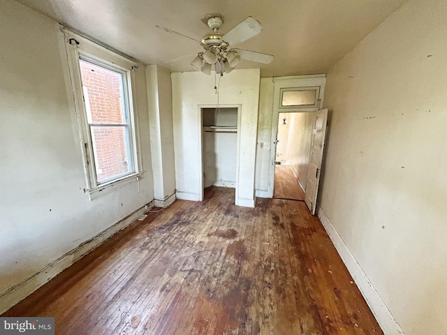 2904 Winchester St, Baltimore, MD 21216 - unfurnished bedroom featuring hardwood / wood-style floors, a closet, baseboards, and ceiling fan