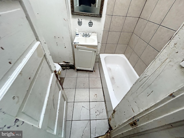 2904 Winchester St, Baltimore, MD 21216 - full bath featuring vanity, a tub to relax in, and tile patterned floors