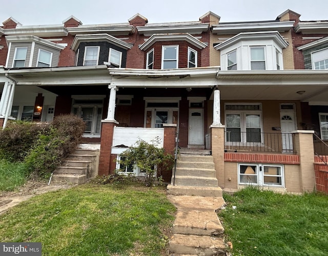 2904 Winchester St, Baltimore, MD 21216 - multi unit property featuring a porch, brick siding, and stairway