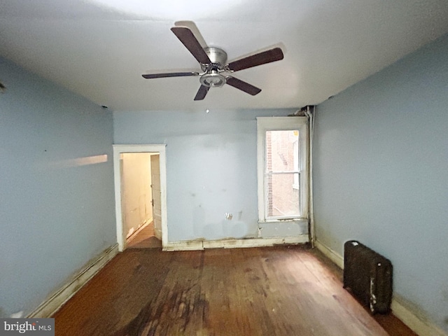 2904 Winchester St, Baltimore, MD 21216 - spare room featuring wood finished floors, baseboards, and a ceiling fan