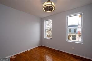 1743 E Oliver St, Baltimore, MD 21213 - unfurnished room featuring wood finished floors