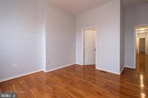 1743 E Oliver St, Baltimore, MD 21213 - unfurnished bedroom featuring wood finished floors and baseboards