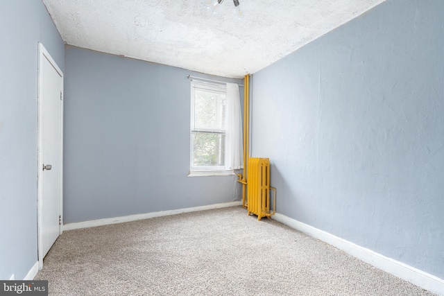 2014 N 4th St, Philadelphia, PA 19122 - carpeted spare room with radiator heating unit, baseboards, and a textured ceiling