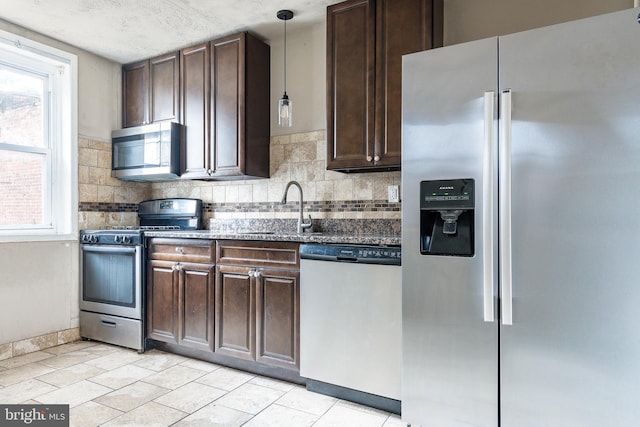 2014 N 4th St, Philadelphia, PA 19122 - kitchen featuring appliances with stainless steel finishes, a sink, dark brown cabinetry, and tasteful backsplash