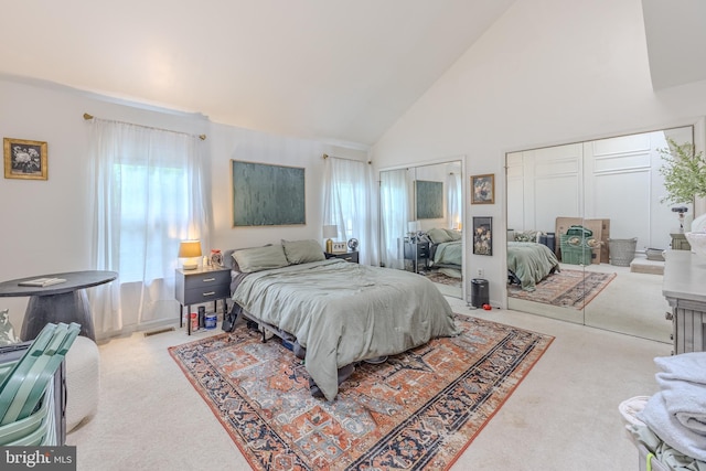 6150 Castletown Way, Alexandria, VA 22310 - bedroom with carpet flooring, two closets, and high vaulted ceiling