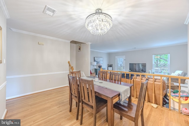6150 Castletown Way, Alexandria, VA 22310 - dining space with a chandelier, light wood-style flooring, ornamental molding, and baseboards