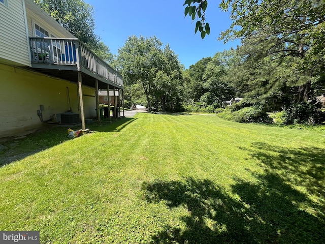 7001 Kepner Ct, Lanham, MD 20706 - view of grassy yard featuring a wooden deck and central AC